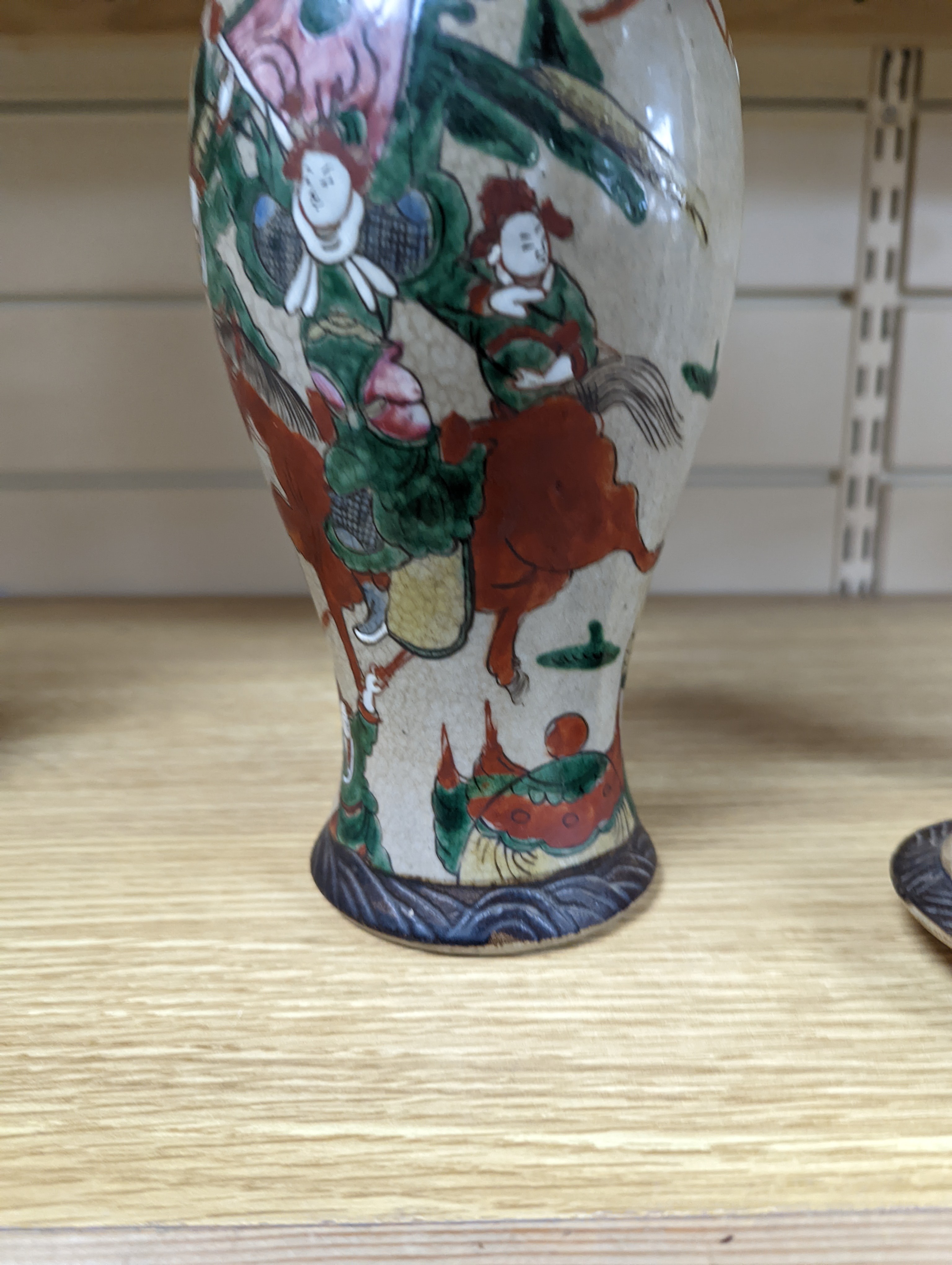 A late 19th century Chinese crackle glaze famille rose baluster vase and cover 30cm